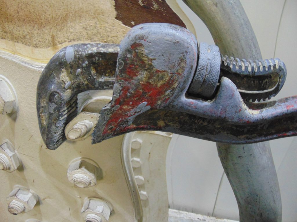 Old hand wrench and twisted nut graphic from www.LadiesToolKit.com